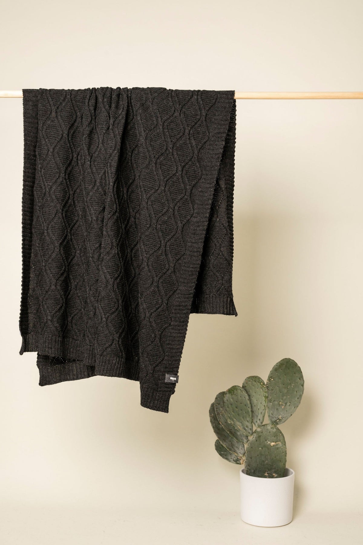 Merino cable-knit throw